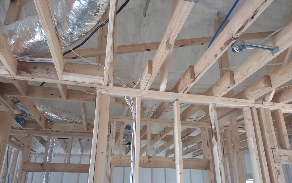 HVAC ductwork and wiring roughed in between the framing